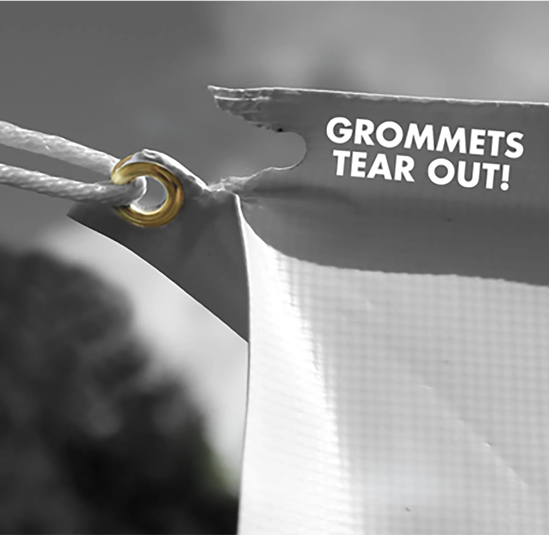 Before — banner torn at grommet point
