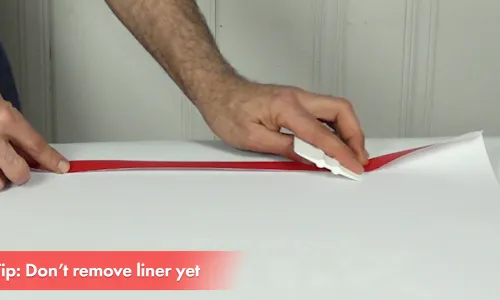 Step 2 - Pre-crease the banner edge over the tape