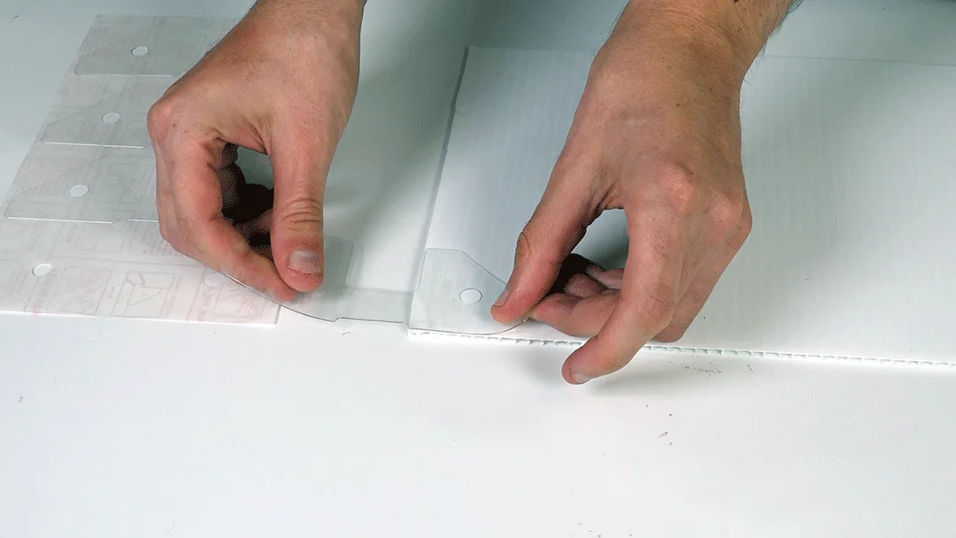 Clear PowerTab pressed onto coroplast surface