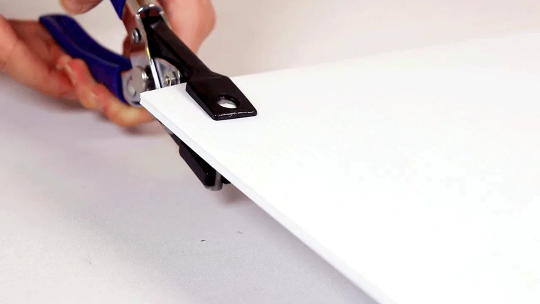 PowerPunch cutting a clean hole through coroplast without crumpling the flutes